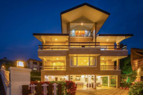 StayVista's Emilia Villa - Terrace with Deck, Outdoor Jacuzzi, Indoor Activities, Garden, and Gym